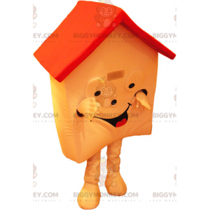 Πολύ χαμογελαστό πορτοκαλί και κόκκινο σπίτι μασκότ