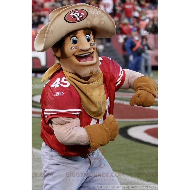 Fantasia de mascote de cowboy musculoso sorridente BIGGYMONKEY™ Fantasia de mascote de cowboy musculoso sorridente BIGGYMONKEY™