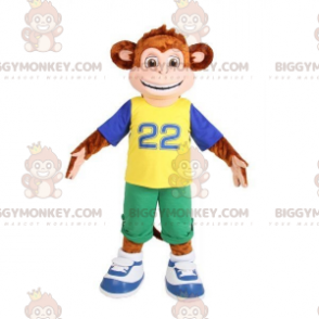 Ruskea apina BIGGYMONKEY™ maskottiasu, joka on pukeutunut värikkääseen asuun - Apinan maskotit - BiggyMonkey.com