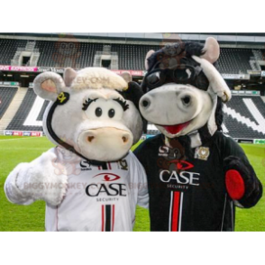 2 BIGGYMONKEY™s mascot cows, one white and one black -
