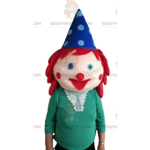 Tête de clown géante avec les cheveux rouges et un chapeau -