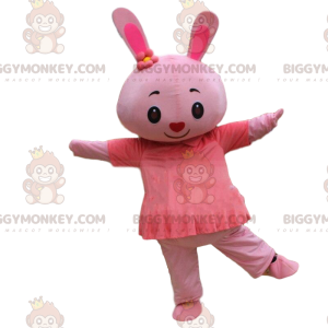 Costume da coniglietta rosa con un vestito e un naso a forma di