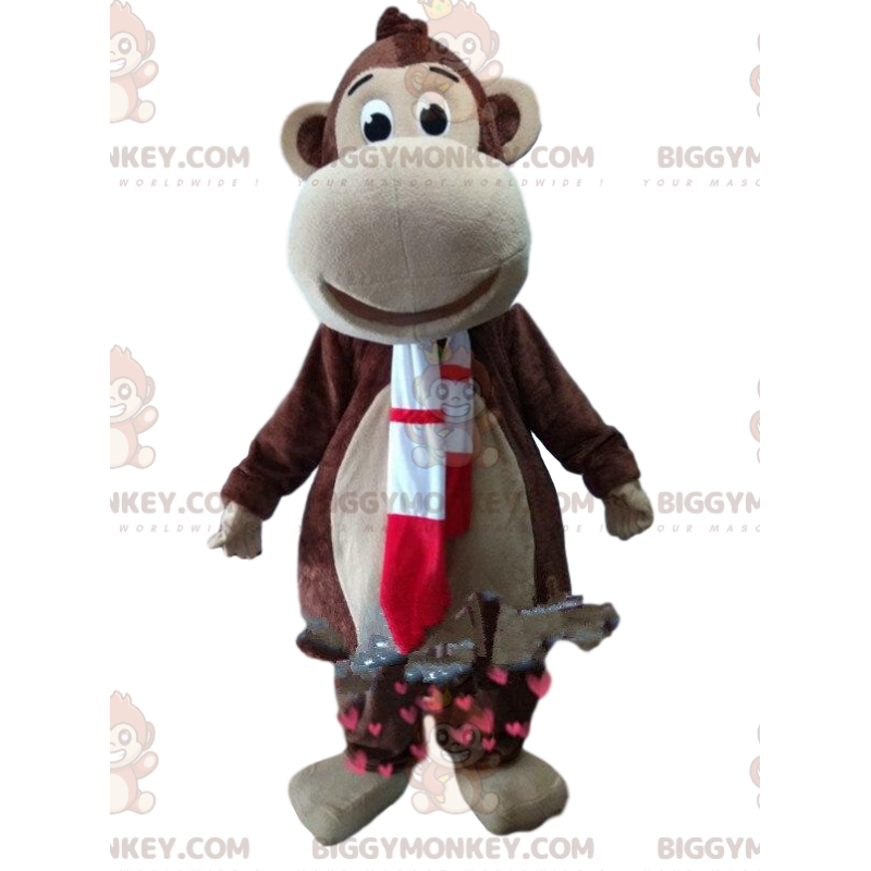 Ruskea apina BIGGYMONKEY™ maskottiasu punaisella ja valkoisella Ruskea apina BIGGYMONKEY™ maskottiasu punaisella ja valkoisella