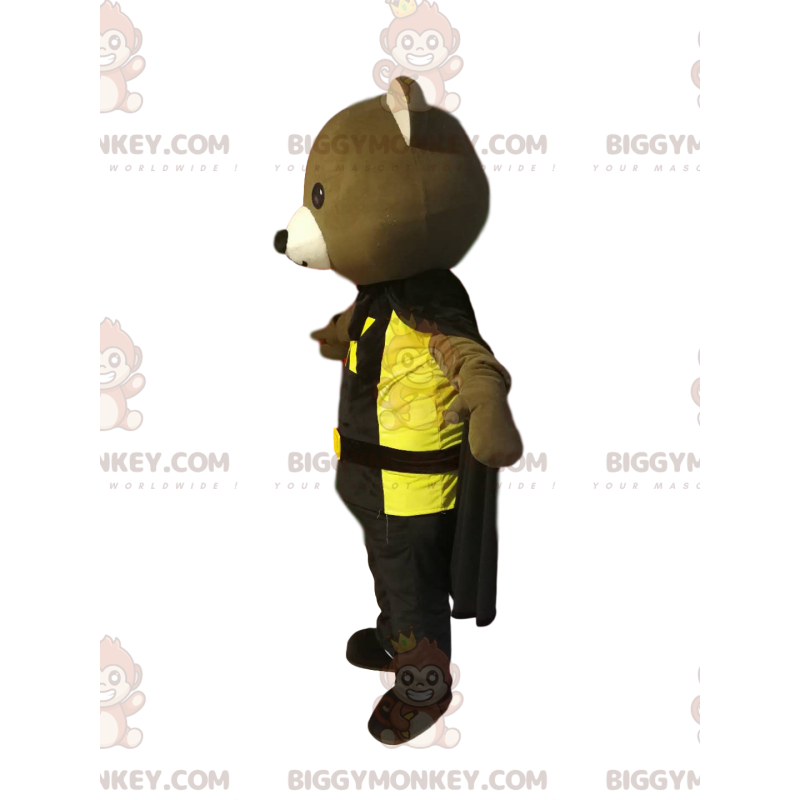 Björnen BIGGYMONKEY™ maskotdräkt med svart cape och gul t-shirt Björnen BIGGYMONKEY™ maskotdräkt med svart cape och gul t-shirt
