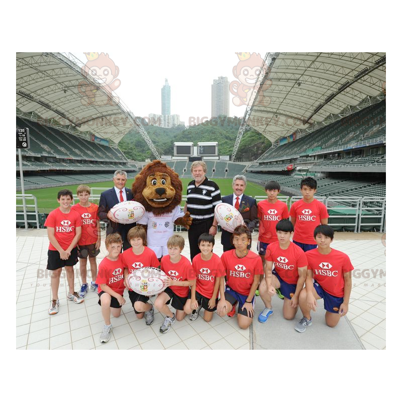 Kostium maskotki BIGGYMONKEY™ Brązowy lew w białej sportowej Kostium maskotki BIGGYMONKEY™ Brązowy lew w białej sportowej