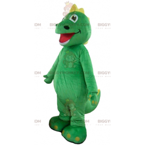 Dinosaur-de-rosa da mascote de pelúcia com uma barriga verde e