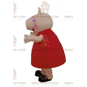 Kostým maskota BIGGYMONKEY™ Růžové prase s červenými šaty –