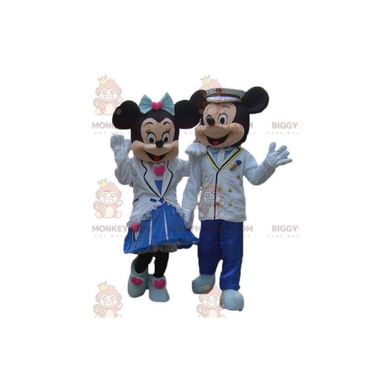 2 hyvin pukeutunutta söpöä Minnie ja Mikki Hiiri maskottia