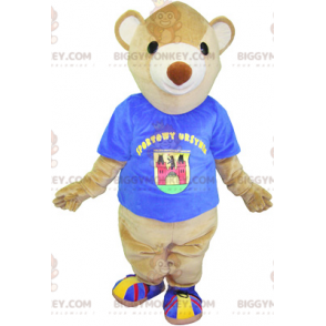 Kostým maskota BIGGYMONKEY™ béžový medvídek s modrým tričkem –